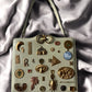 1960s Ivory Leather ‘Gathered Charm’ Bag